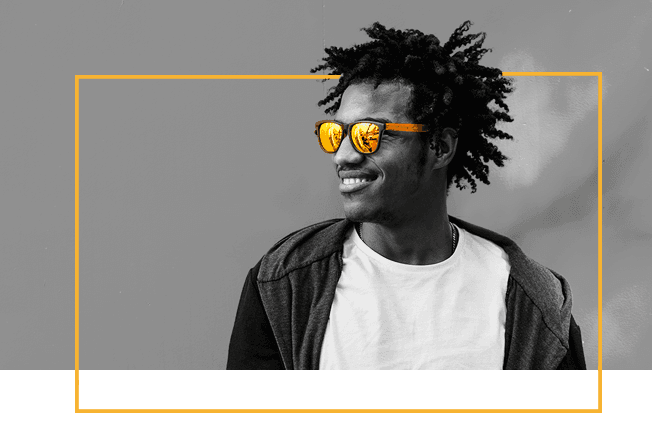A smiling Cash Converters team member wearing yellow sunglasses
